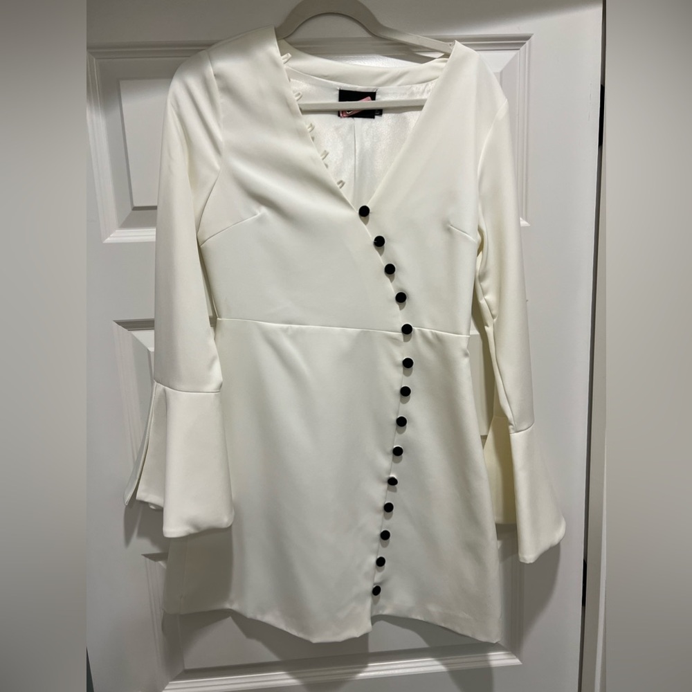 White Do+Be dress with black button detail down front and tulip sleeves. Worn 1x